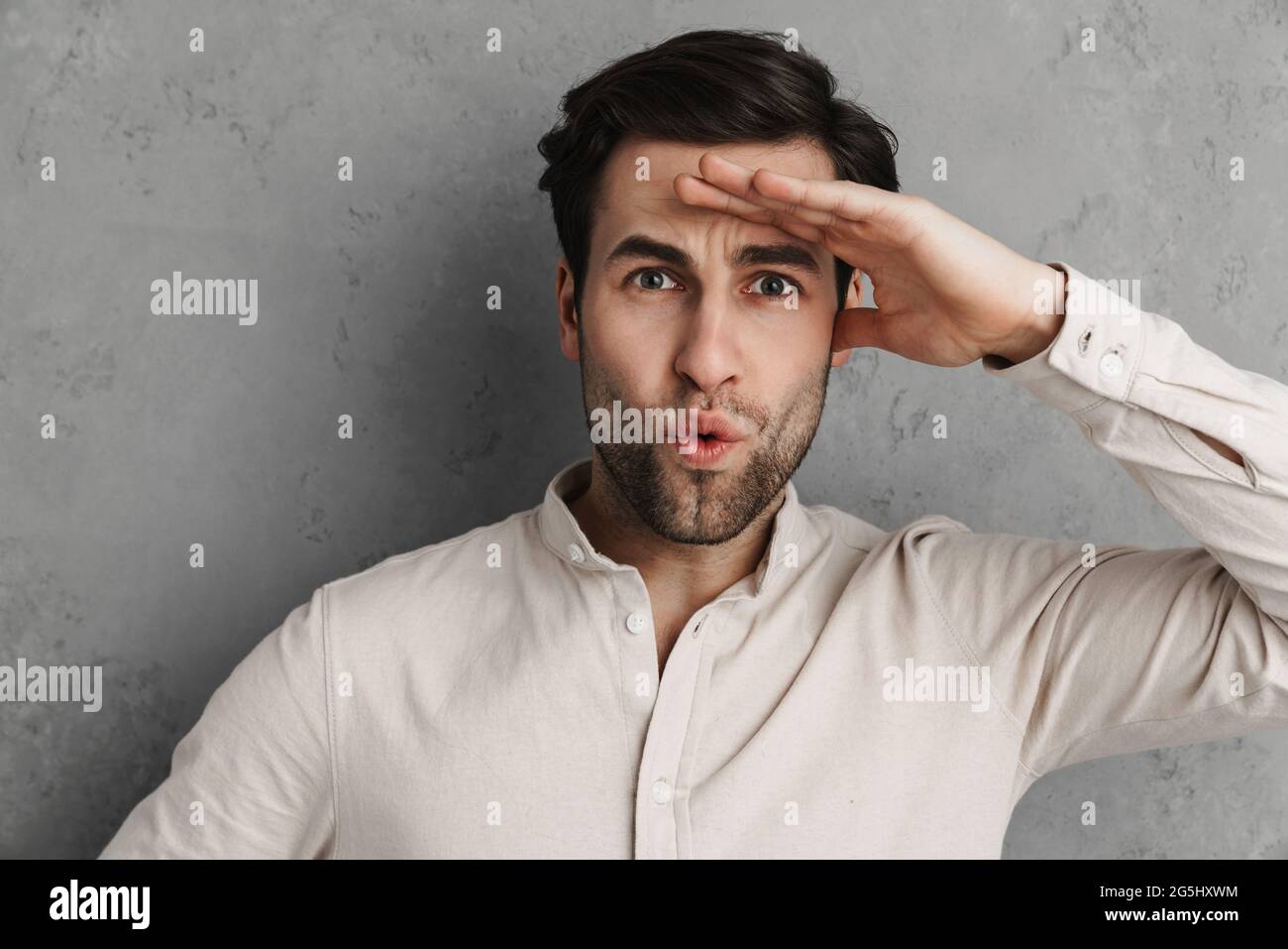 Surprised handsome unshaven guy hi-res stock photography and images - Alamy