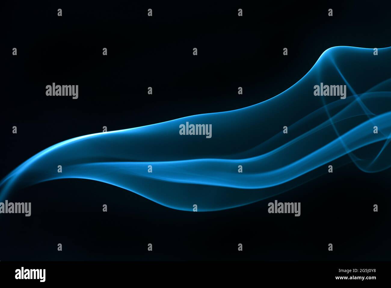 Blue smoke isolated on black background Stock Photo - Alamy