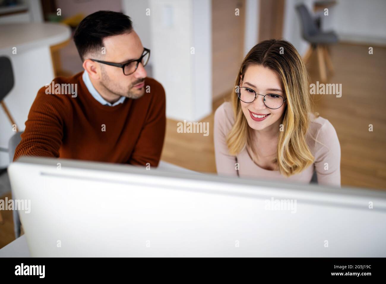 Young creative managers team working with new startup project in office Stock Photo