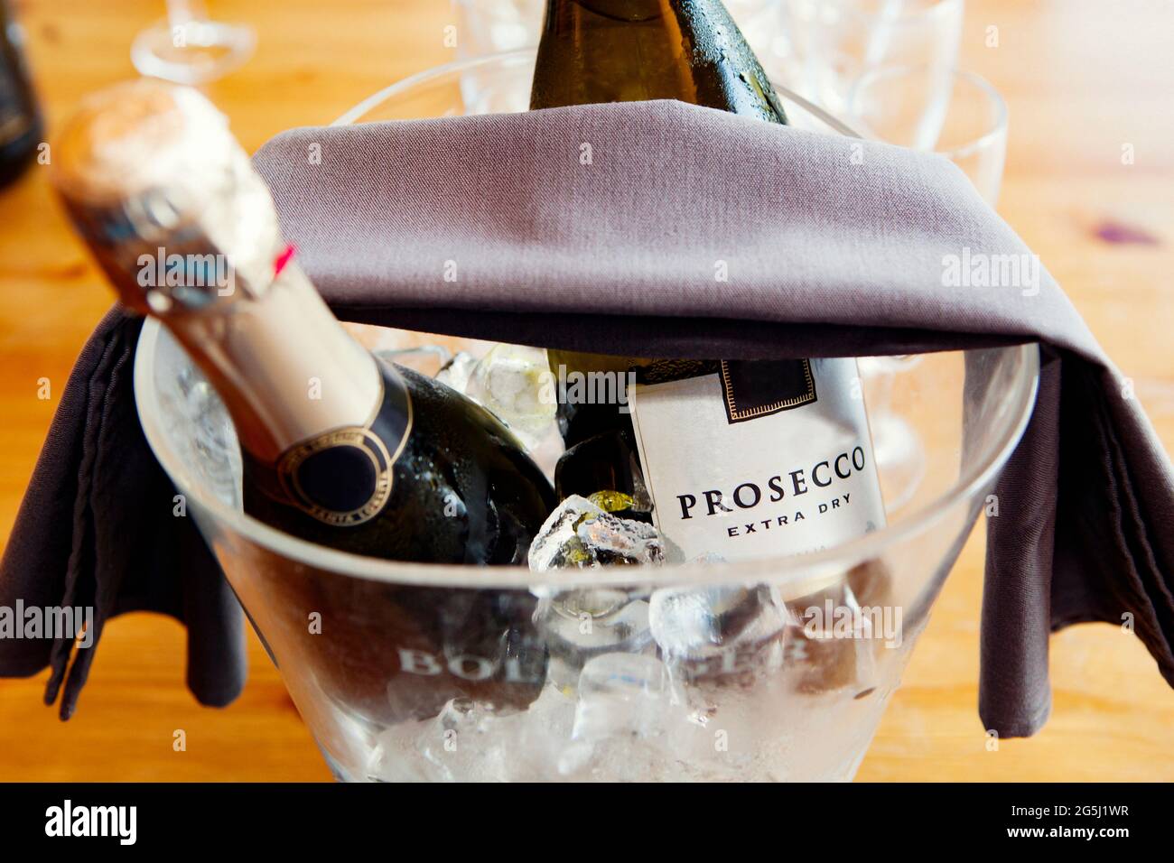 Prosecco bottes in an ice bucker Stock Photo