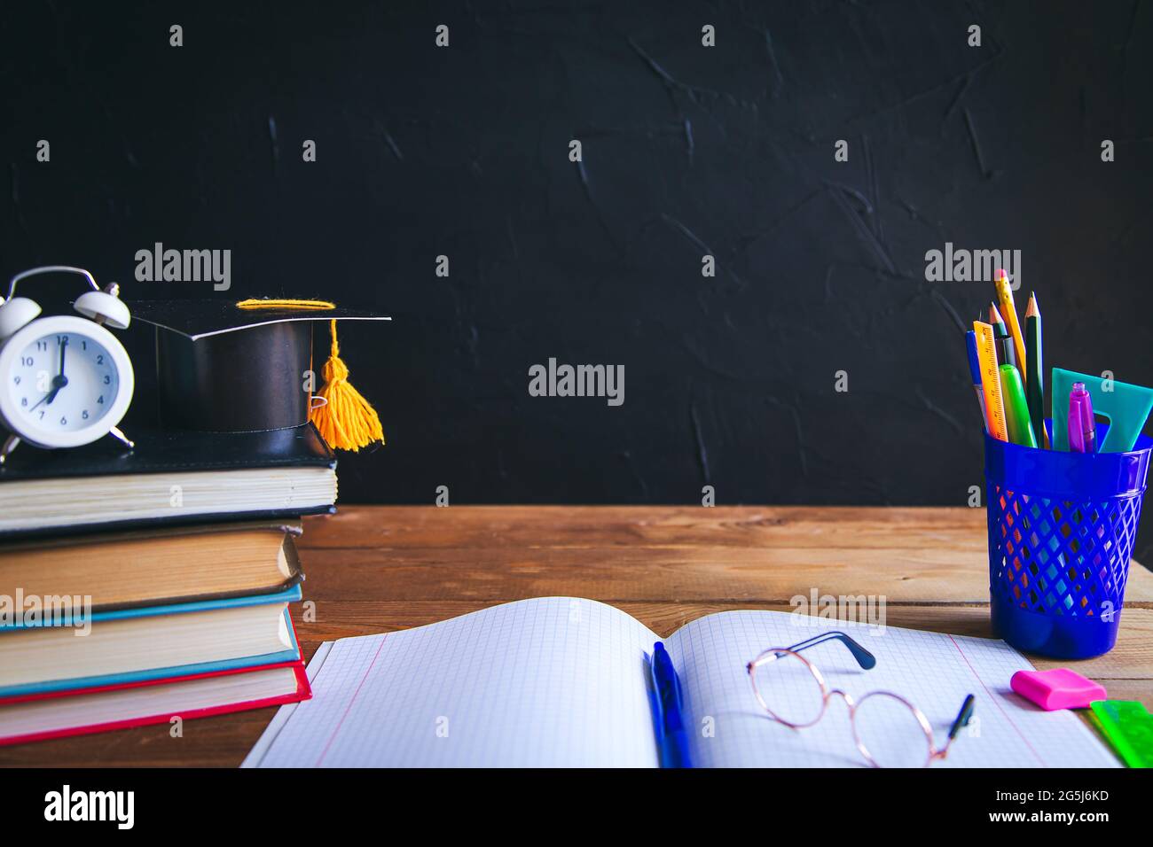 Education or back to school Concept. glasses, pencils, note books, chalk,  eraser over chalkboard background Stock Photo - Alamy