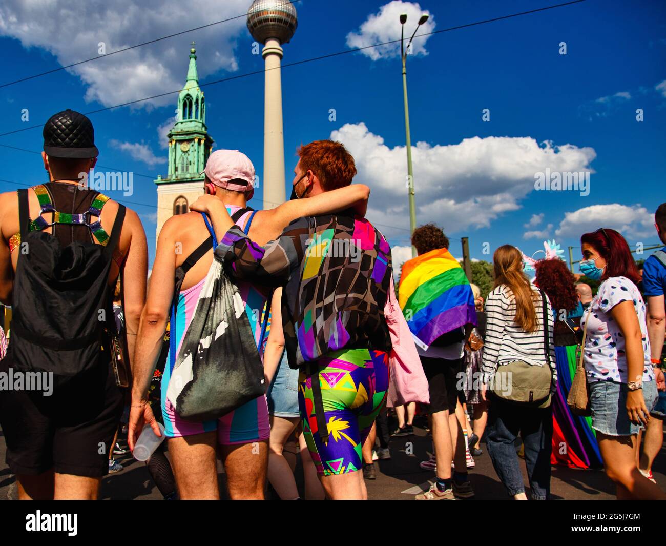 Berlin, Germany - June 26, 2021 - People at Christopher Street Day (CSD) with the Berlin TV tower in the background Stock Photo