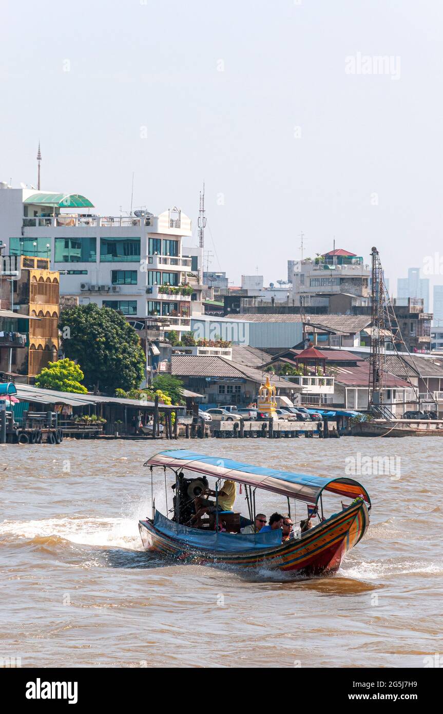 A traditional Thai long-tail boat on the Chao Phraya river in Bangkok in Thailand in South East asia. Stock Photo