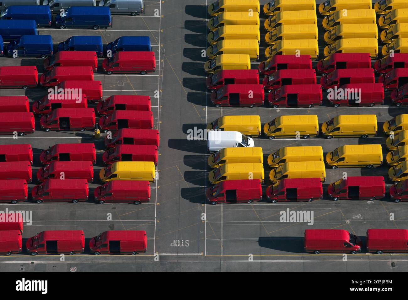 UK, Essex, Purfleet Docks, Aerial view of rows of colorful vans Stock Photo