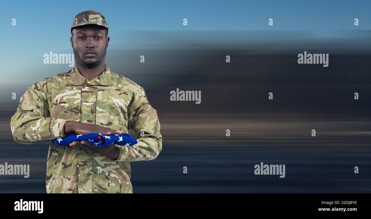 Composition of soldier with holding folded american flag Stock Photo ...