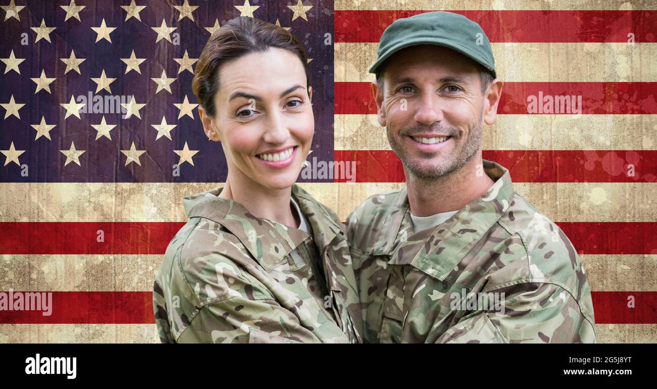 Composition of smiling male and female soldier embracing, against american flag Stock Photo