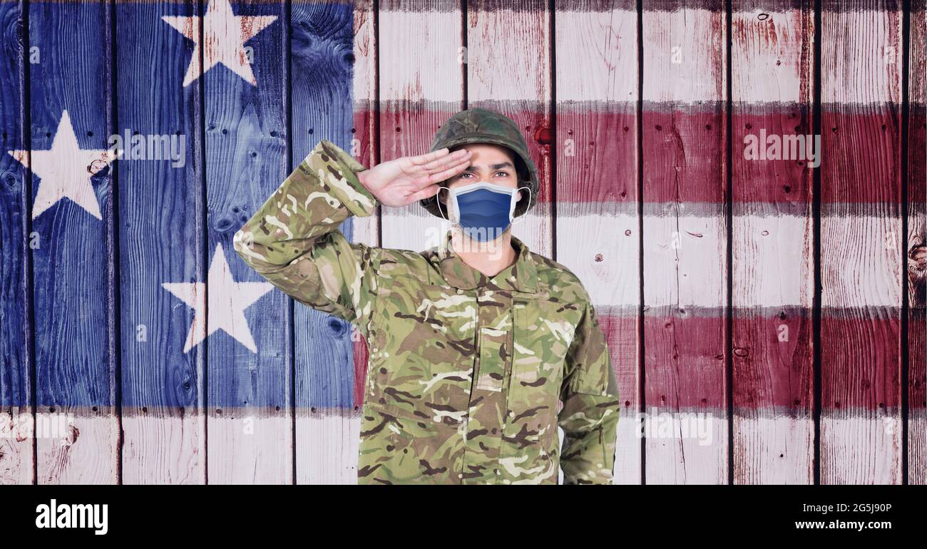 Composition of saluting soldier wearing face mask, against american ...