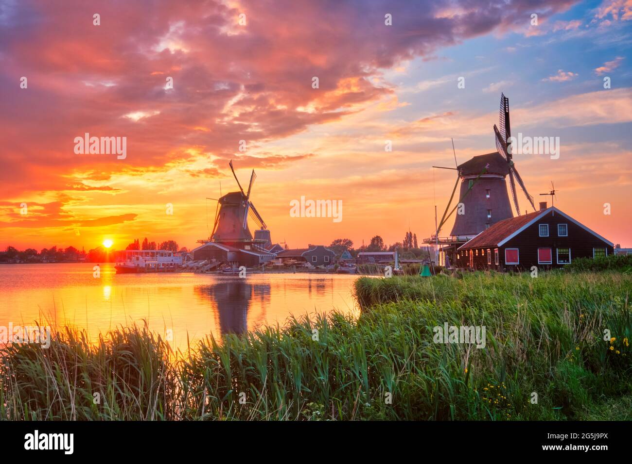 Windmills at Zaanse Schans in Holland on sunset. Zaandam, Nether Stock