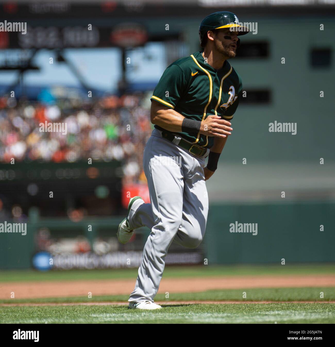 June 27 2021 San Francisco CA, U.S.A. Oakland Athletics third baseman Chad  Pinder (4) rounds 3rd base coming into home during the MLB game between the Oakland  Athletics and the San Francisco