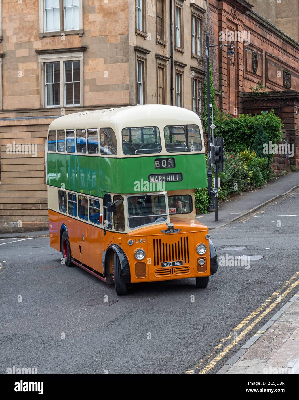 Glasgow, Scotland, UK. 26th June, 2021. Glasgow Vintage Vehicle Trust showcase their collection of vintage buses around the streets of Glasgow as part Stock Photo