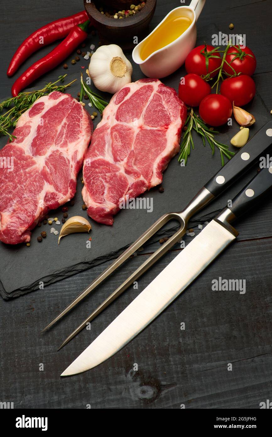 Fresh raw beef or pork steaks on stone cutting serving board Stock ...