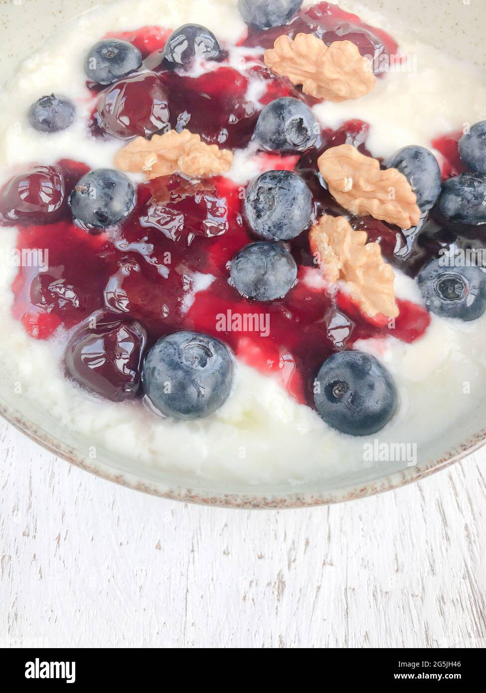 breakfast with yogurth with blueberry jam and walnuts Stock Photo Alamy