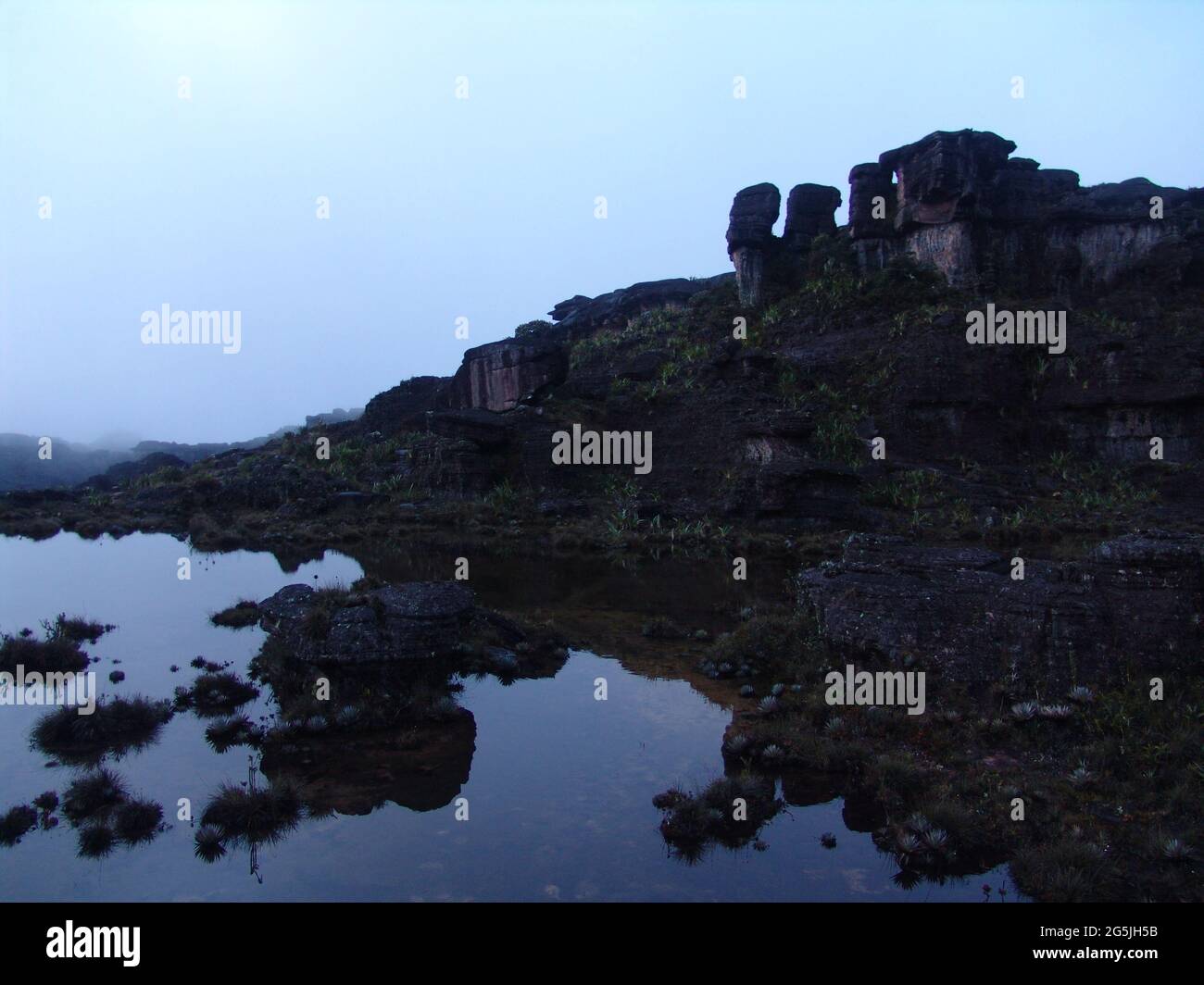 Many stone formations near a lake on the climbing path of Mount Roraima in Venezuela Stock Photo