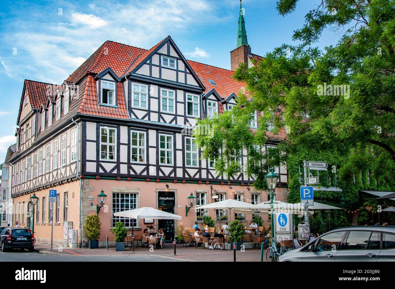 HANNOVER, GERMANY. JUNE 19, 2021. Beautiful view on street with buildings in fachwerk style, prussian wall. Stock Photo