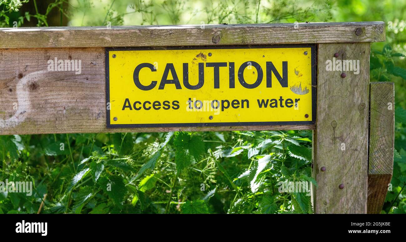 Sign warning Caution access to open water at Figgate Park, Edinburgh