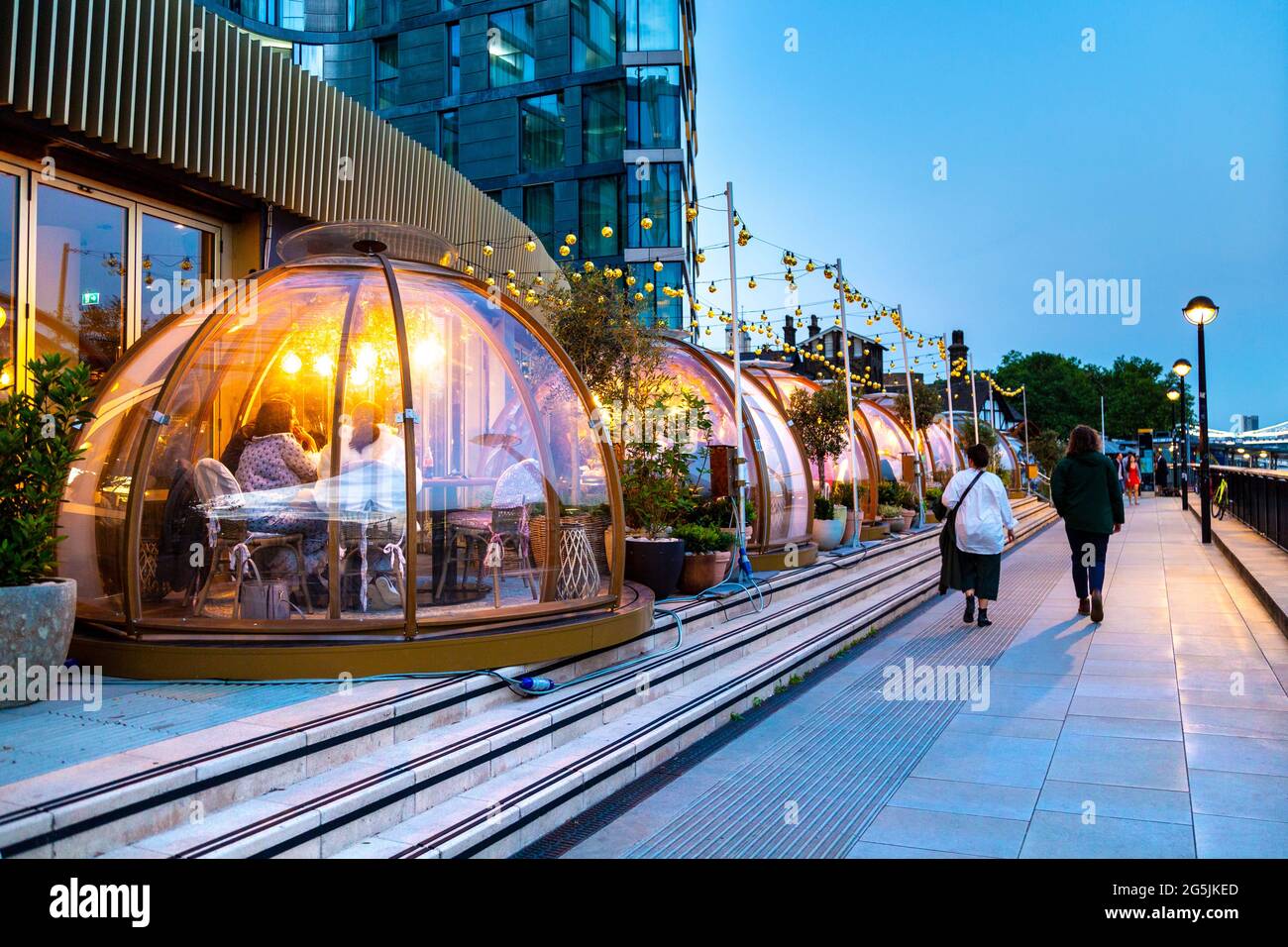 Dining igloos at Coppa Club restaurant on the Thames riverbank, Tower, Hill, London, UK Stock Photo