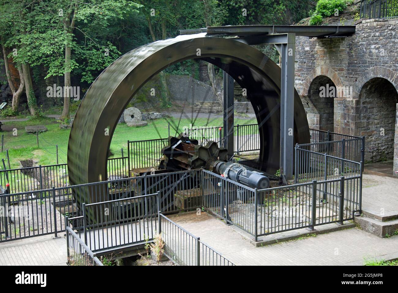 Water wheel at Aberdulais, Neath, Wales. Timed, long exposure, showing the wheel in operation Stock Photo