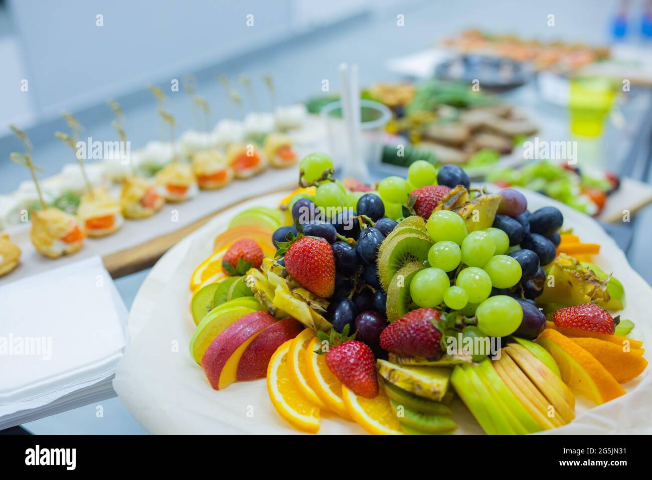 Dinner table with snacks decorated with beautiful summer flowers. Food ...