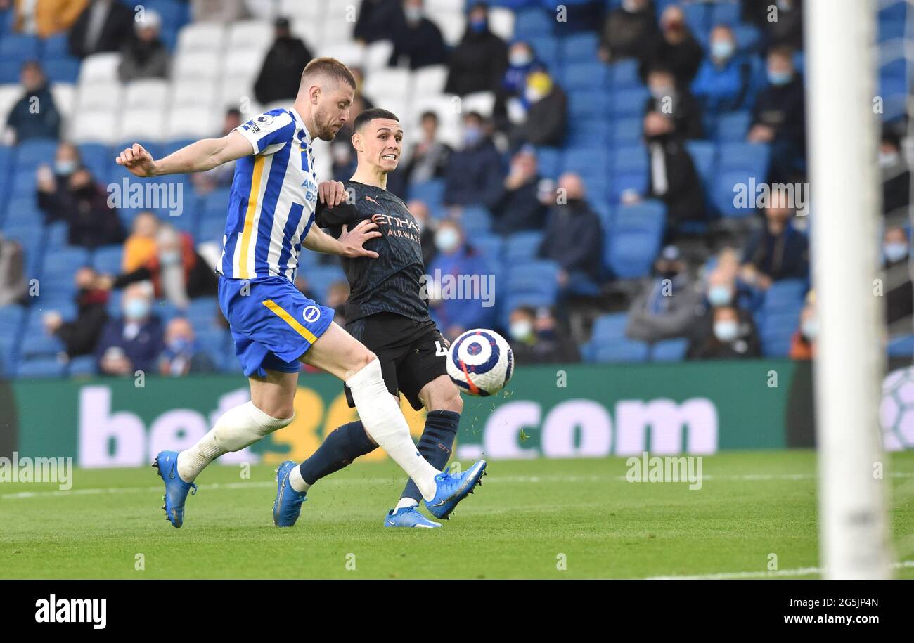 Phil Foden of Manchester City scores their second goal during the Premier League match between Brighton and Hove Albion and Manchester City at the American Express Stadium , Brighton , UK - 18th May 2021 - Editorial use only. No merchandising. For Football images FA and Premier League restrictions apply inc. no internet/mobile usage without FAPL license - for details contact Football Dataco Stock Photo