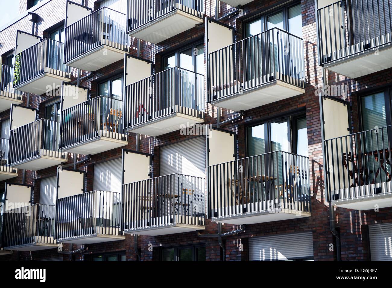 many small balconies with tables and chairs at a student residence in cologne Stock Photo