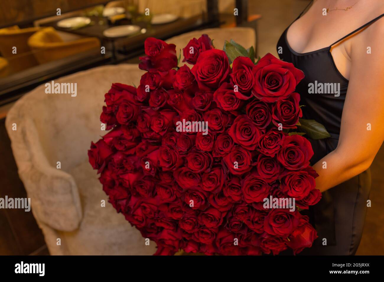 Woman holds luxury bouquet of red roses Stock Photo - Alamy
