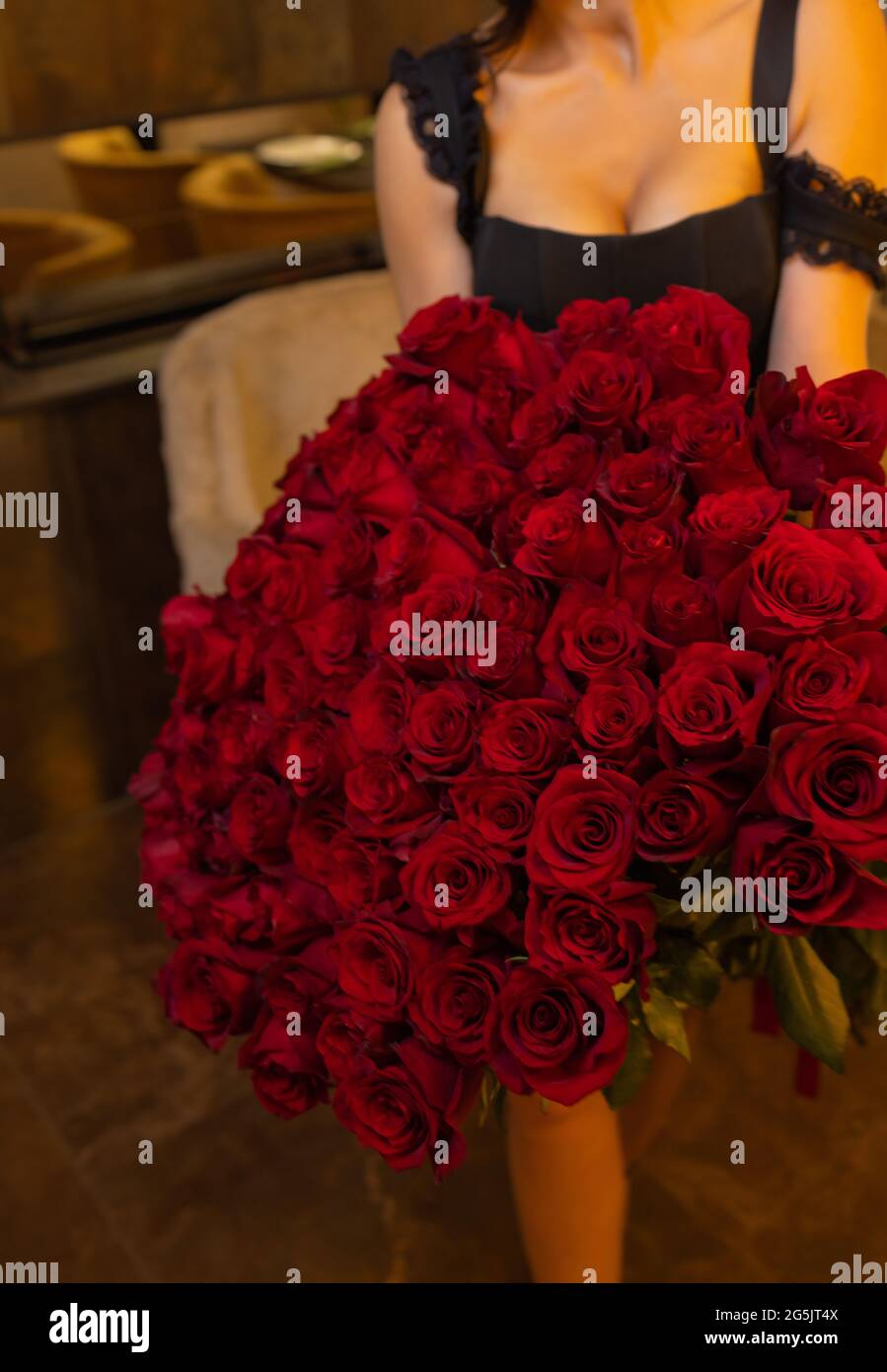 Woman holds luxury bouquet of red roses Stock Photo - Alamy