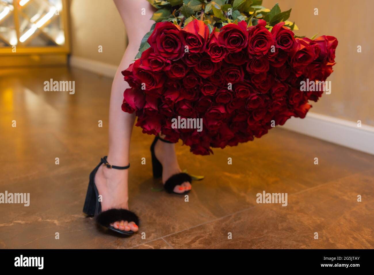 Woman holds luxury bouquet of red roses Stock Photo - Alamy