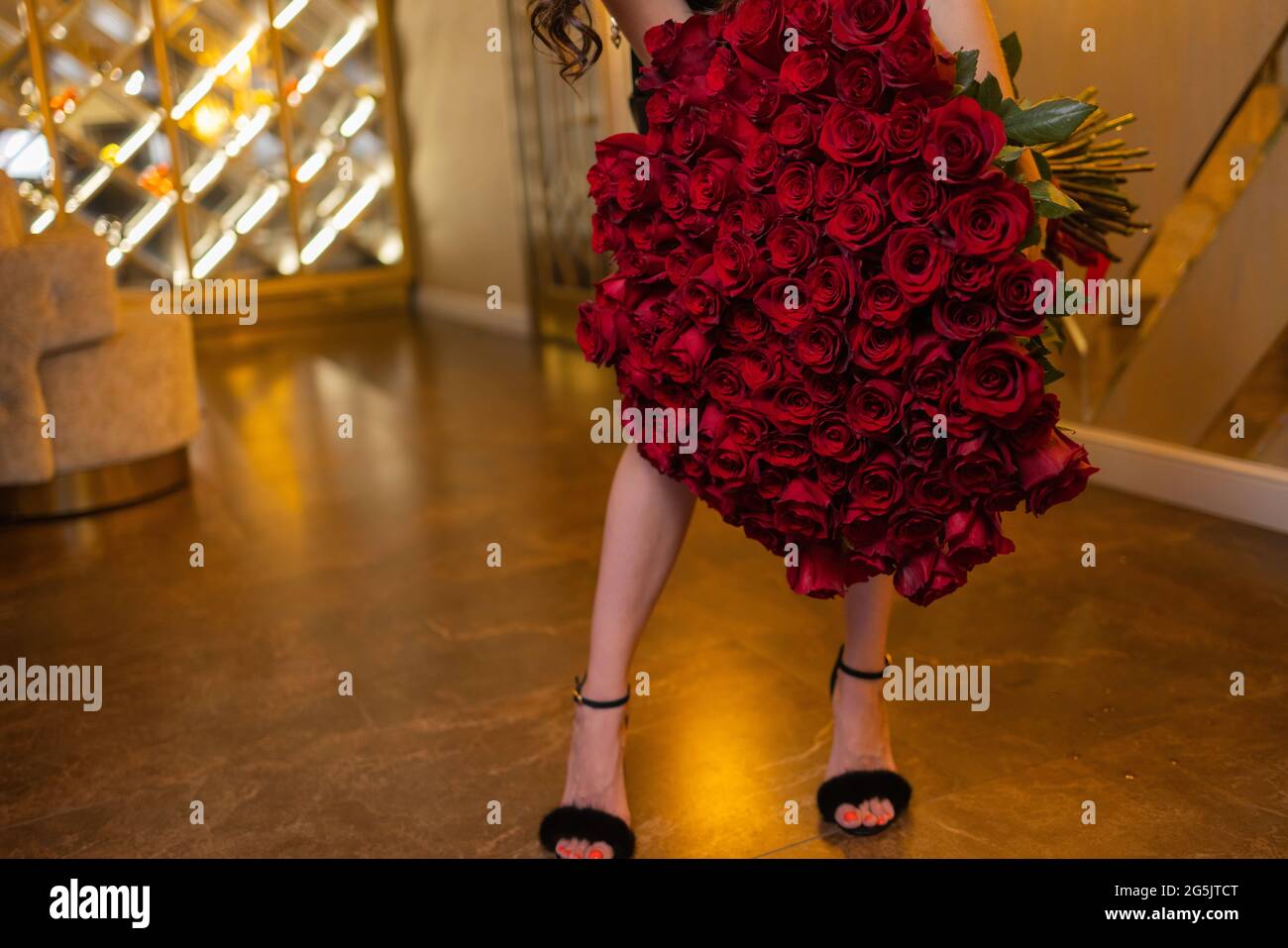 Woman holds luxury bouquet of red roses Stock Photo - Alamy
