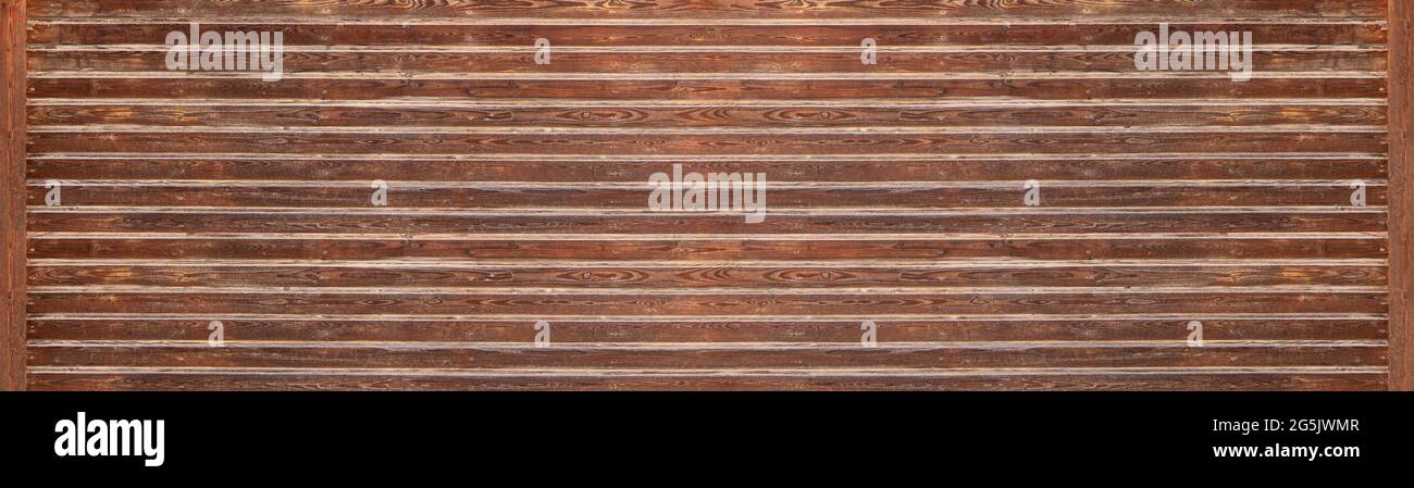 Brown horizontal panoramic wooden wall with applied bright strips Stock Photo