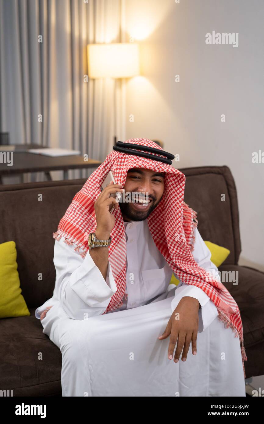 Arab man sitting in sofa hi-res stock photography and images - Alamy