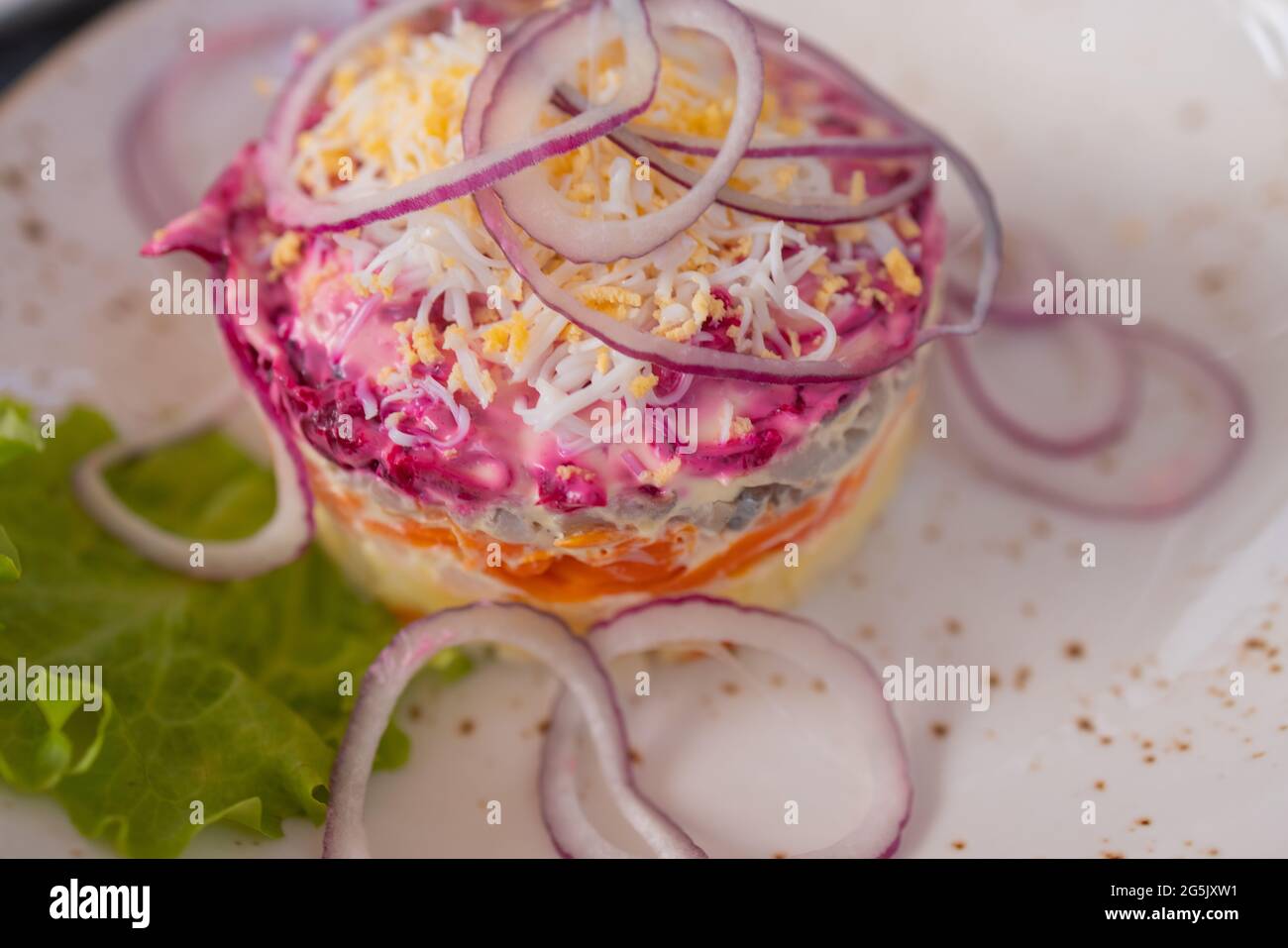 Homemade dressed pickled herring, traditional russian layered salad