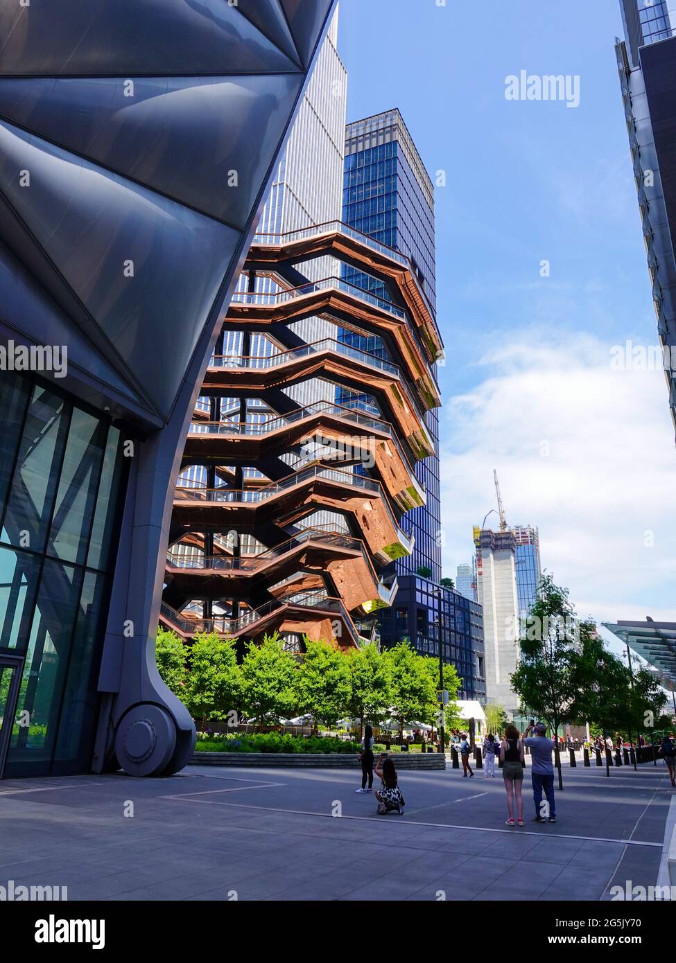 The Vessel, a public art climbing structure, anchors Hudson Yards Public Square at the north end of the High Line, New York, NY, USA Stock Photo