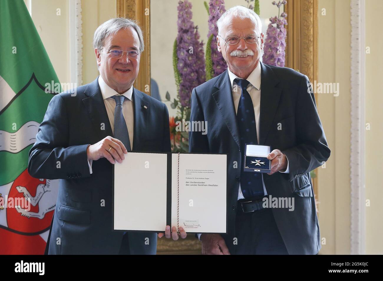 Duesseldorf, Germany. 28th June, 2021. Armin Laschet (CDU, l), Minister President of North Rhine-Westphalia, awards Prof. Dr. Ernst-Andreas Ziegler the State Order of Merit. Credit: David Young/dpa/Alamy Live News Stock Photo