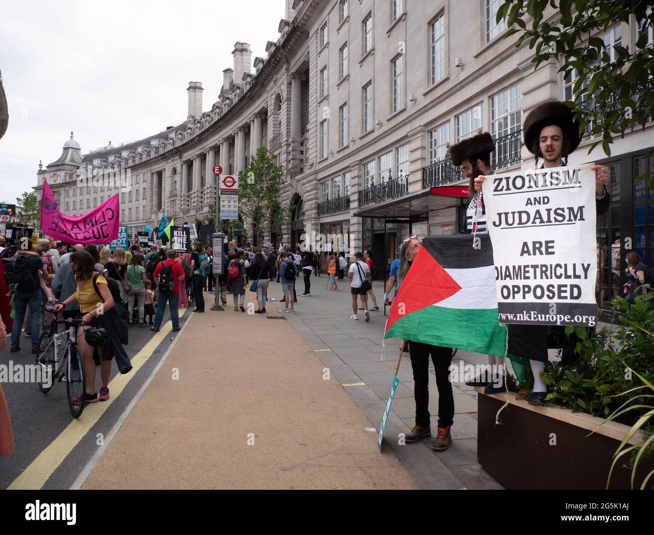 Ultra Orthodox Jews of the Neturei Karta division  from Stamford Hill who represent Orthodox Jews United Against Zionism amongst flags of Palestine attend  the People's Assembly National Demonstration in London. Rabbi Blyer is on left Stock Photo