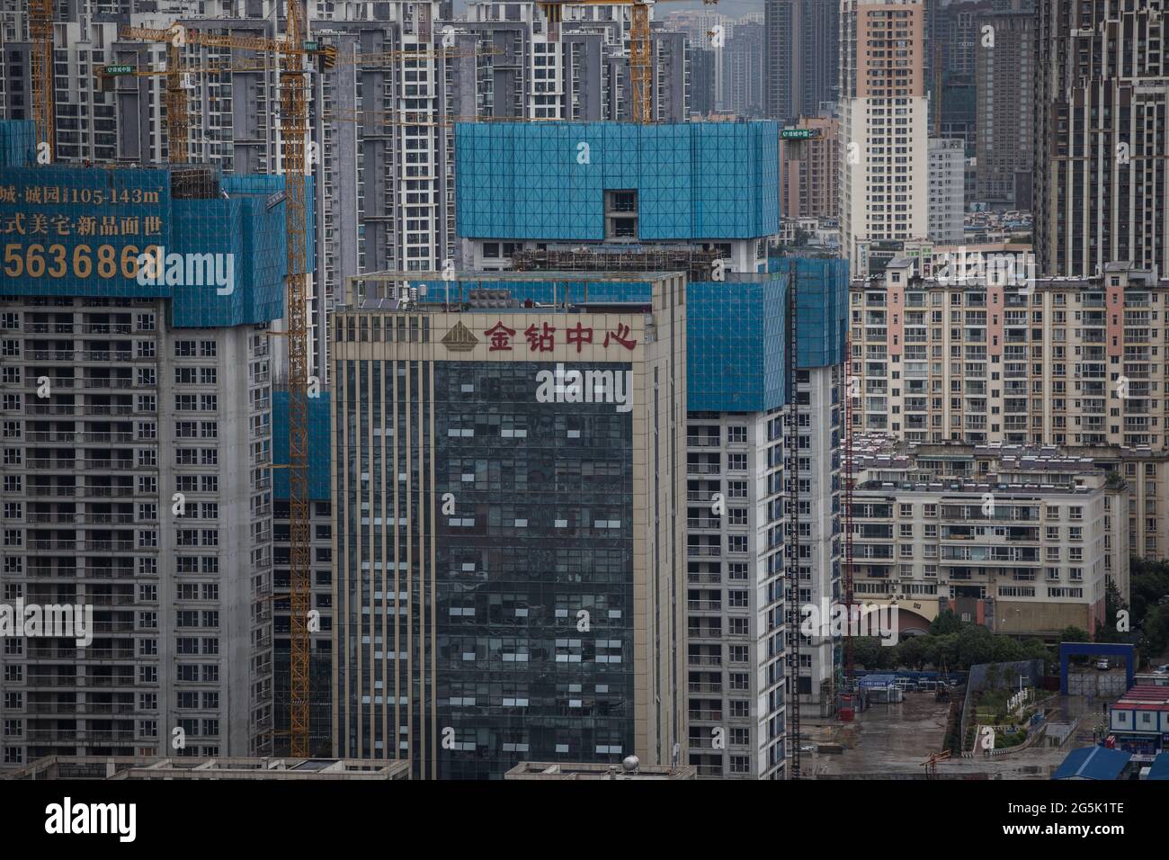View on a Chinese city Kunming with many concrete buildings under construction Stock Photo