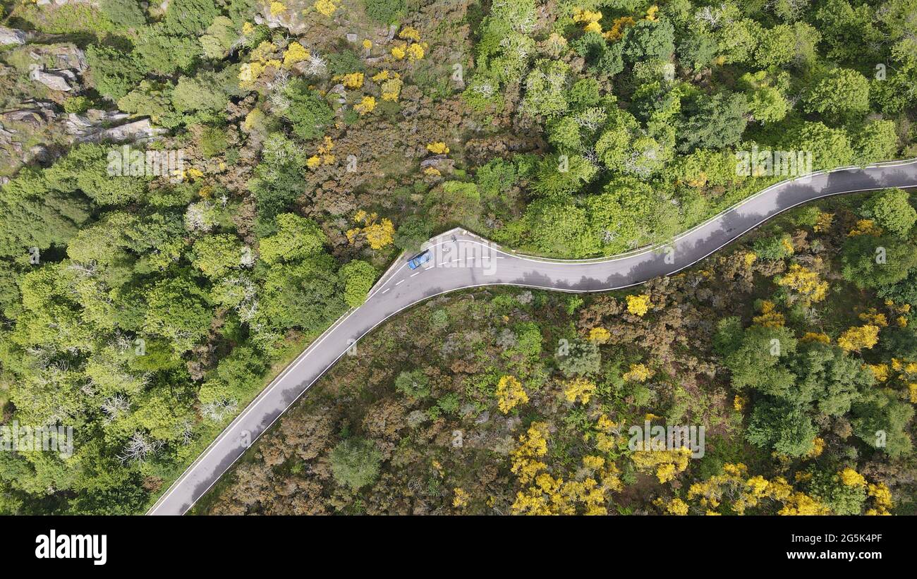 A winding road beside the river sil Stock Photo