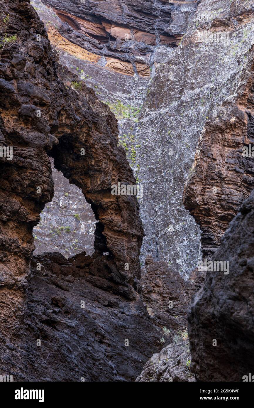 Natural arch in the Barranco of Masca, volcanic ravine, gorge, walk down from the mountain village to the coast, Tenerife, Canary Islands, Spain Stock Photo