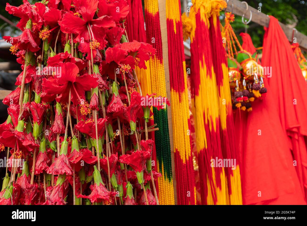 Hinbiscus flowers and worship strings are being sold as worship materials at kalighat, West