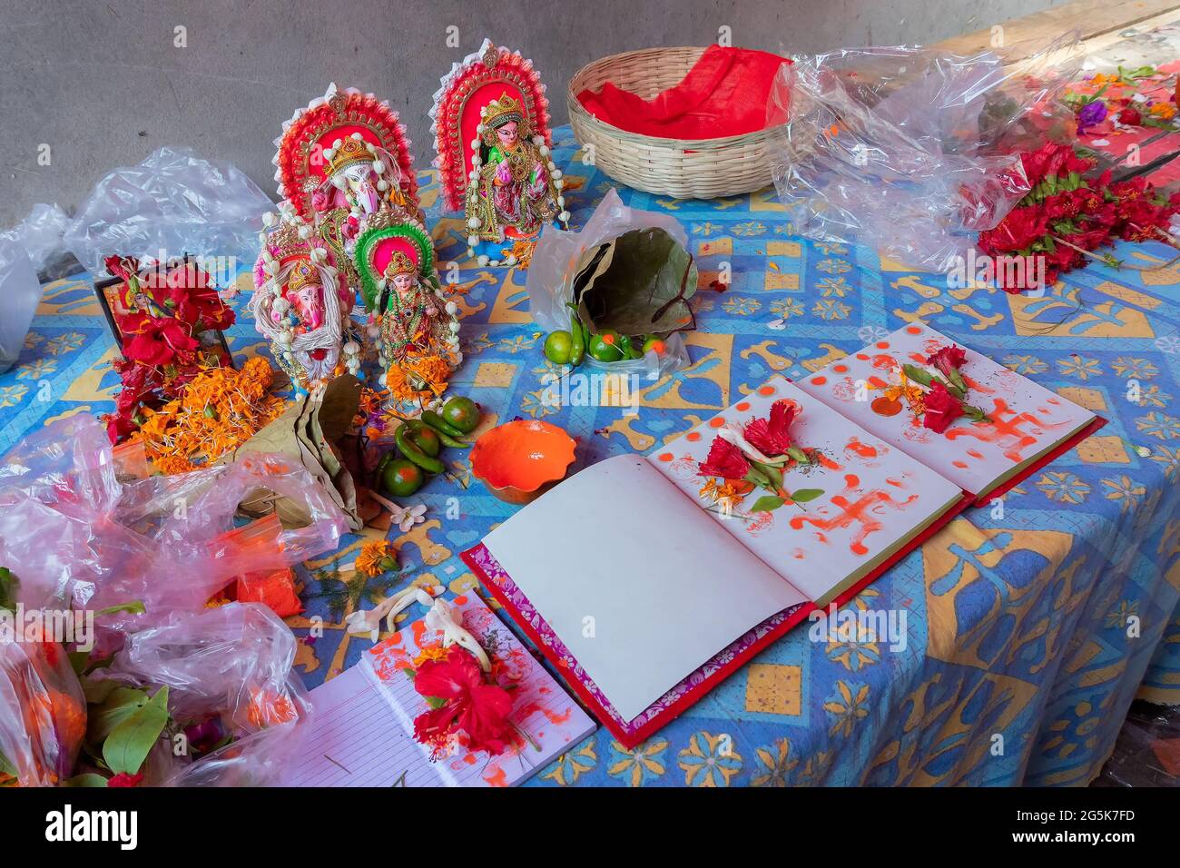 Goddess Laxmi, God Ganesh and new accounts book for new year, are being worshipped with flower and various other materials on auspicious day of Bengal Stock Photo