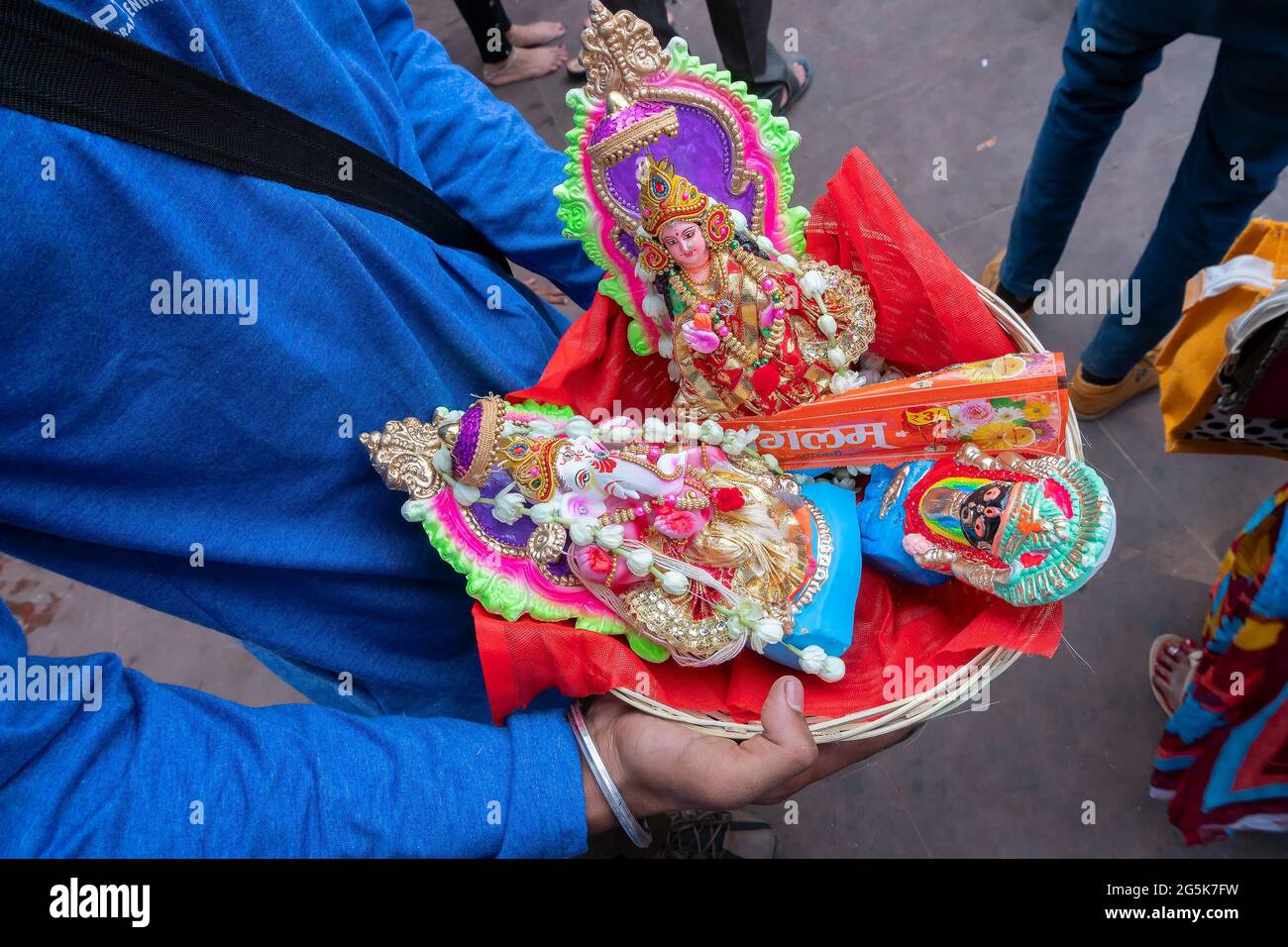 Kalighat, Kolkata, West Bengal, India - April 15th 2019 : Goddess Laxmi, God Ganesh and Goddess Kali on red seat are worshipped on auspicious day of B Stock Photo
