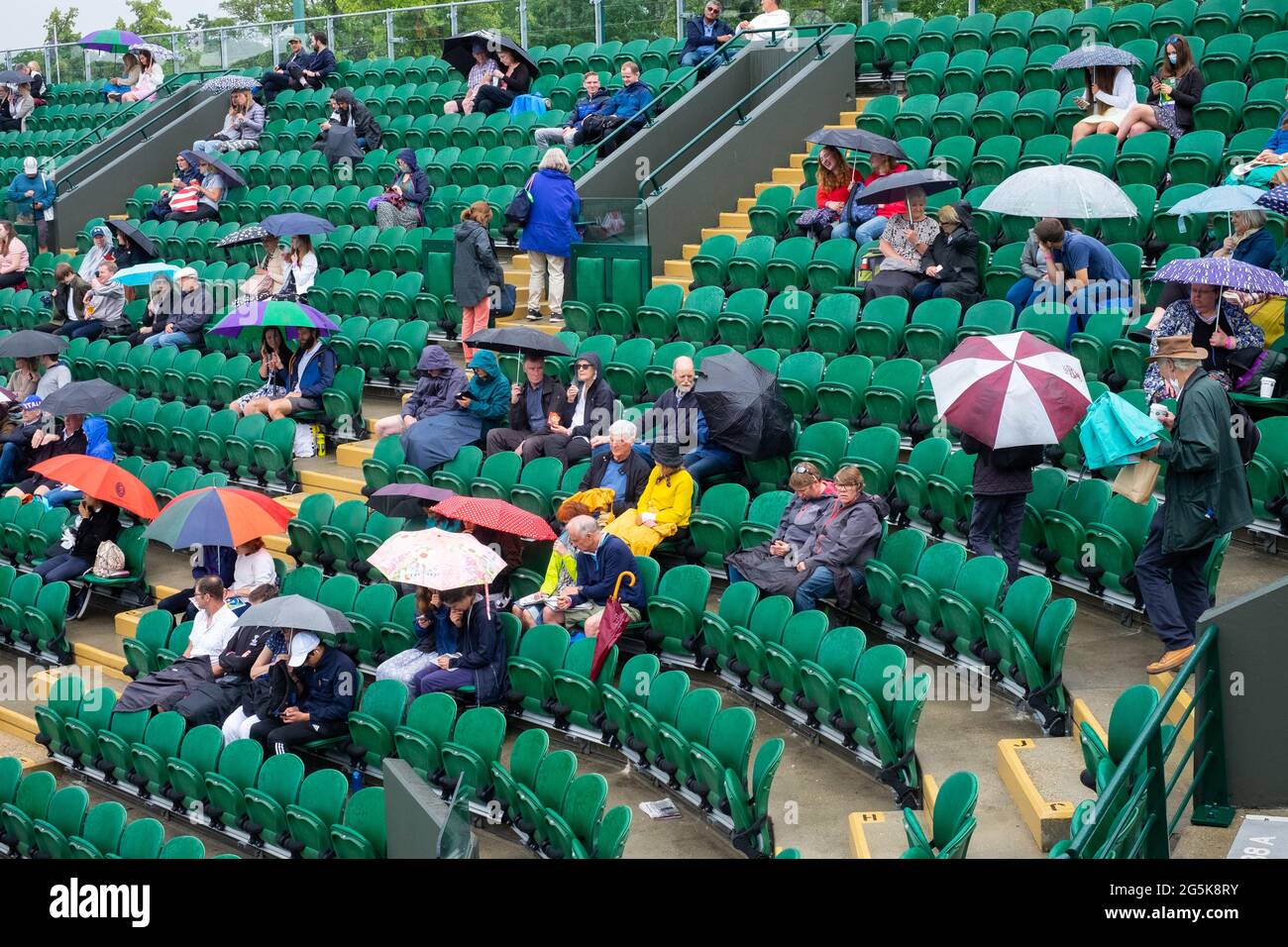 Wimbledon, London, UK. 28th June, 2021. Rain stops play on the outside courts at the All England Club on day one of The Championships 2021, Wimbledon, South West London. Picture date: Monday June 28, 2021. Photo credit should read: Katie Collins/EMPICS/Alamy Credit: Katie Collins/Alamy Live News Stock Photo
