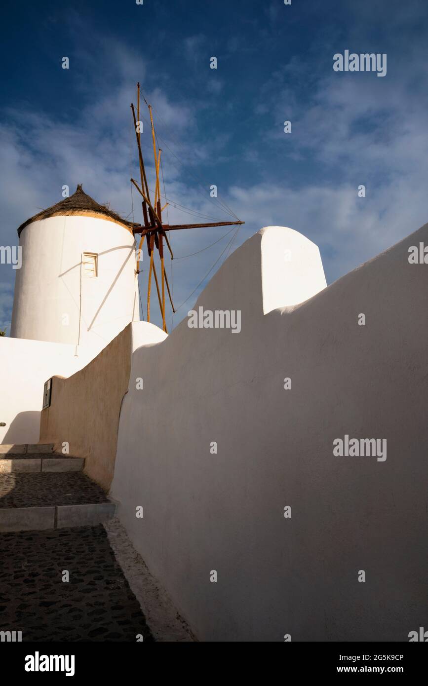 Cycladic style grain windmill on the Greek Island of Santorini in Oia. Stock Photo