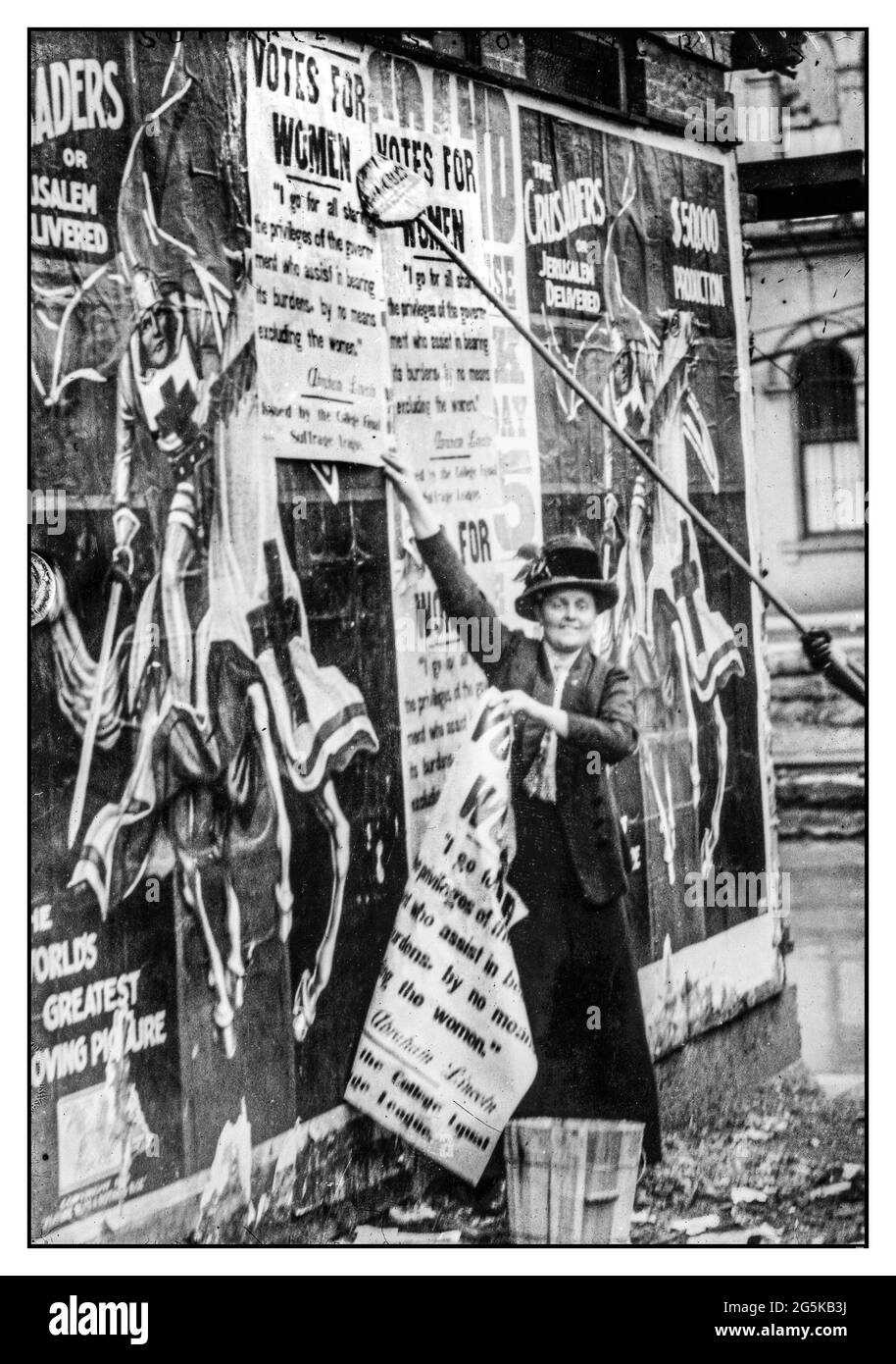 Bill posting for Suffragette movement [Miss Louise Hall with brush and Susan Fitzgerald assisting bill posting in Cincinnati] Contributor Names Bain News Service, publisher Created / Published [between ca. 1910 and ca. 1915] Stock Photo