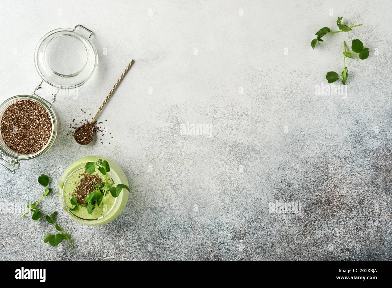Ingredients For Green Smoothie Fresh Organic Spinach Pea Microgreens Banana Kiwi Apple And Chia Seed Over Light Grey Concrete Background Healthy Stock Photo Alamy