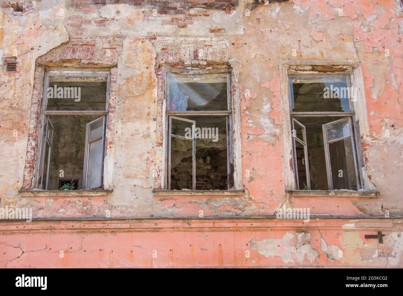 Old red brick wall with destroyed three window Stock Photo - Alamy