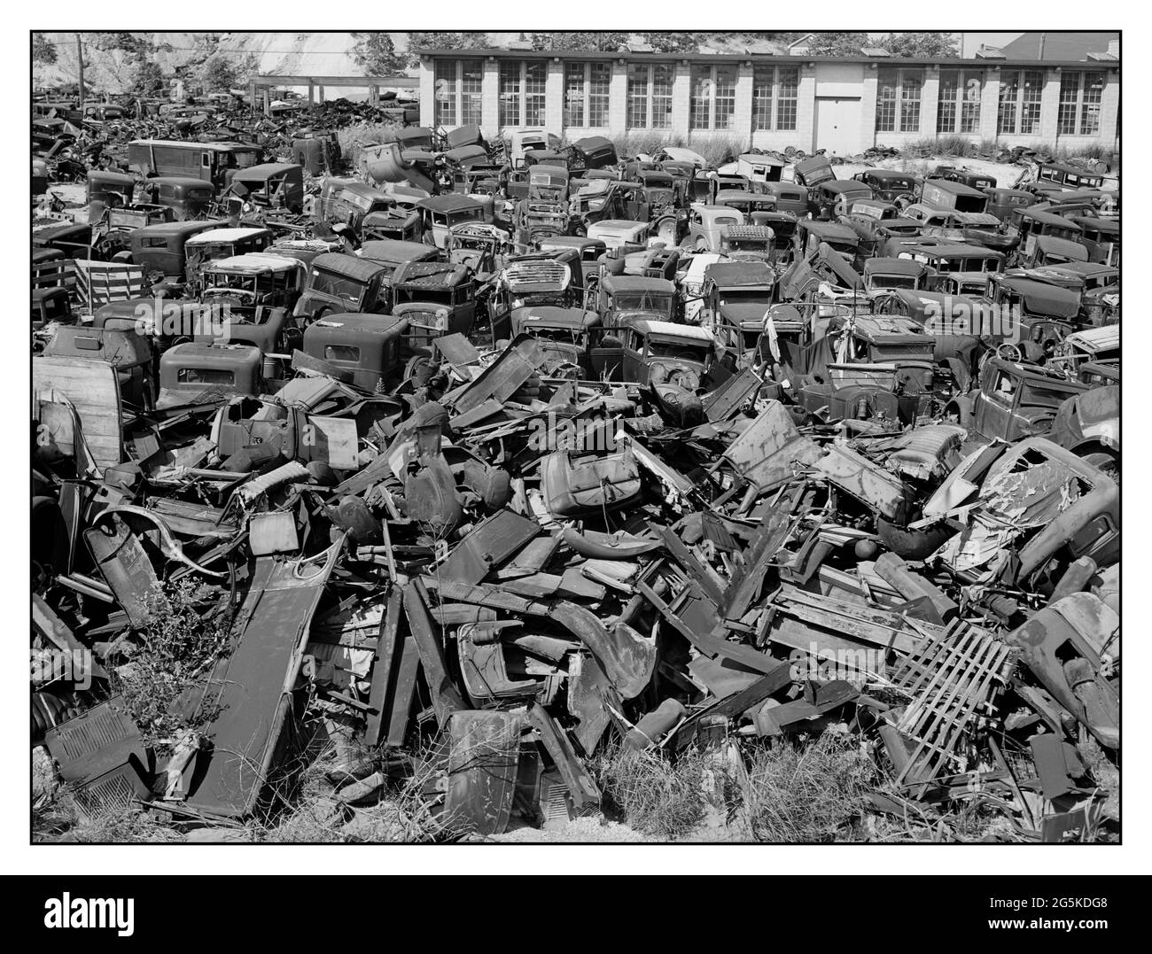CAR SCRAP YARD USA “We wreck anything!' Automobile Car graveyard near Sulphur Springs, Maryland, on U.S. Highway No. 1 Delano, Jack, 1914-1997, photographer. 1940 June. -  United States--Maryland Stock Photo
