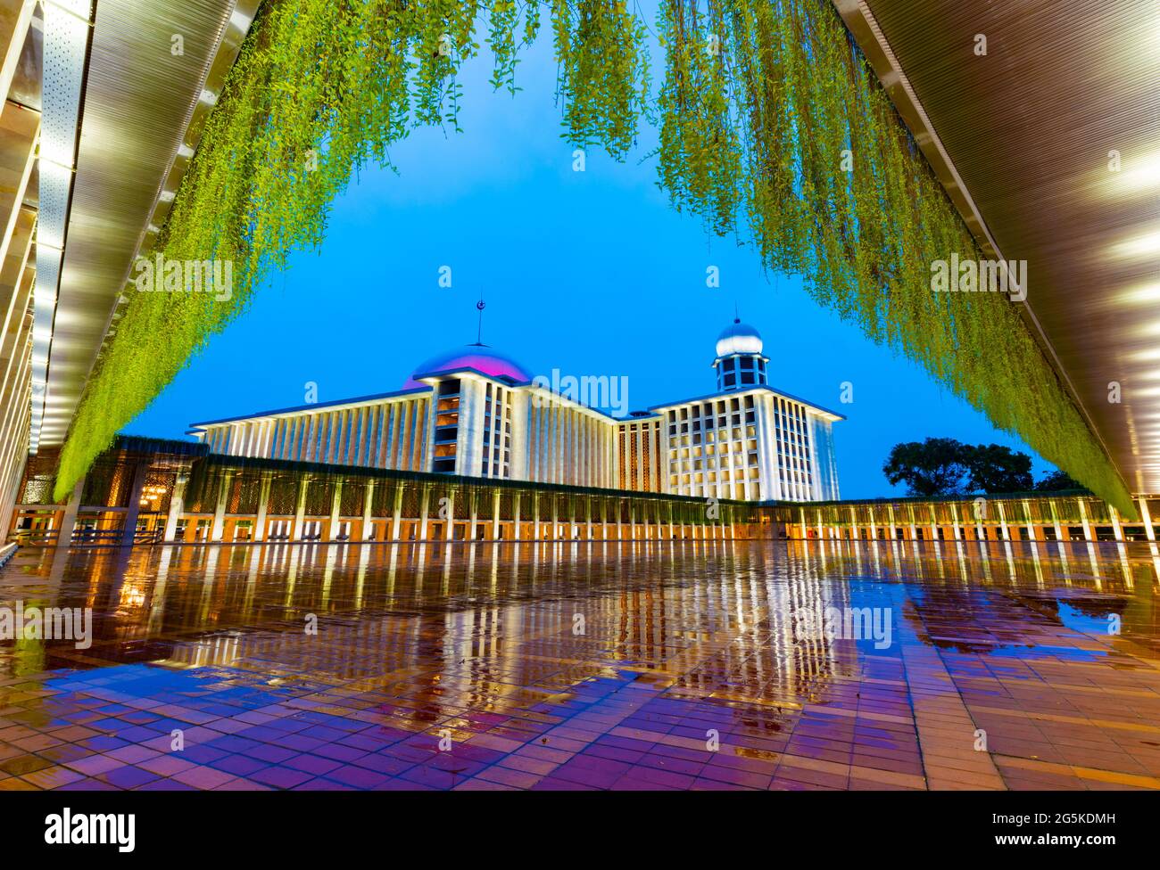 Jakarta, Indonesia - CIRCA June 2021: Exterior of the new Istiqlal Mosque in Jakarta, after renovation in the year 2020, in rainy sunset (blue hour) Stock Photo