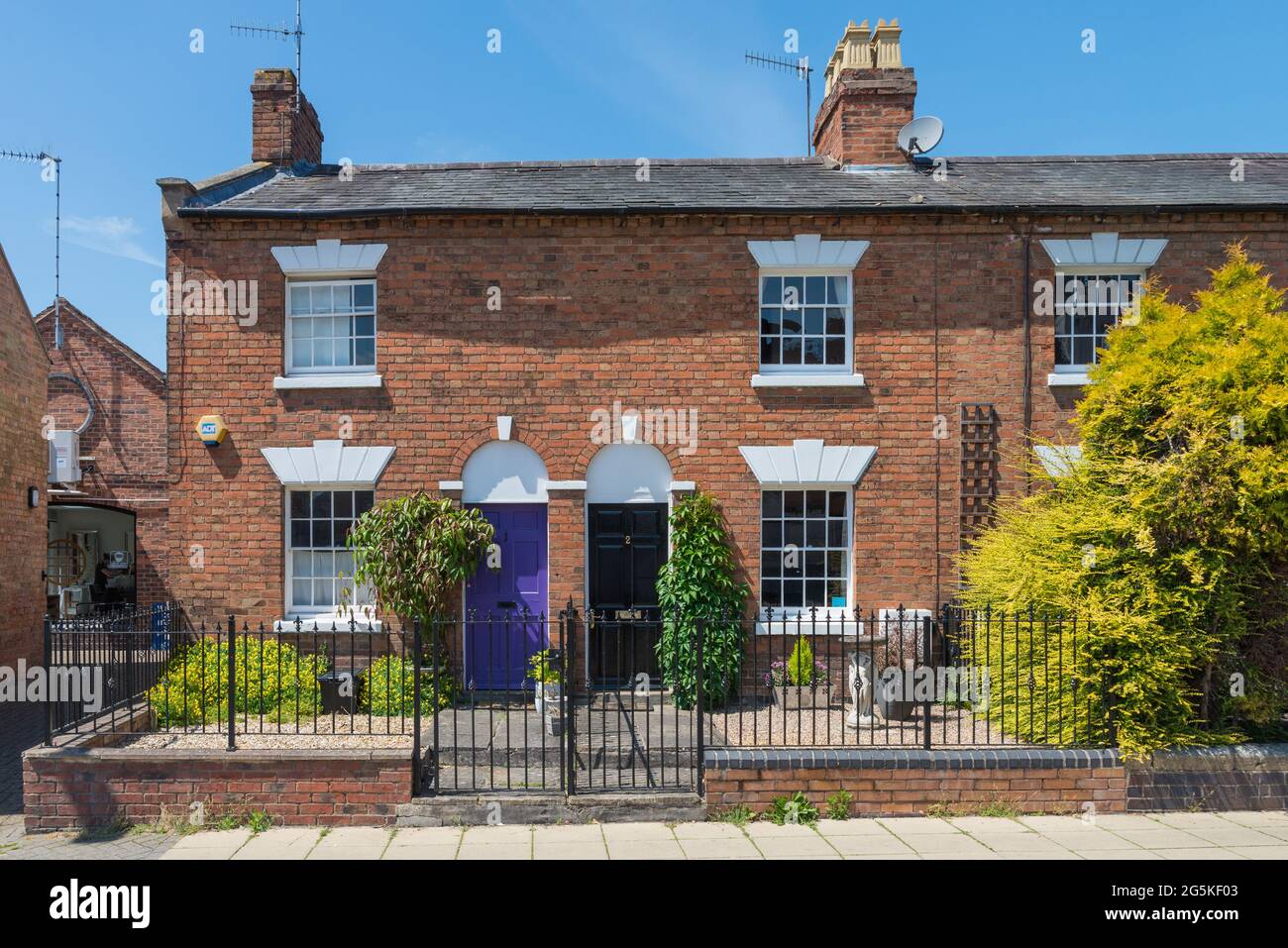 Pair of smart red brick terraced houses on Windsor Street in Stratford-upon-Avon, Warwickshire Stock Photo
