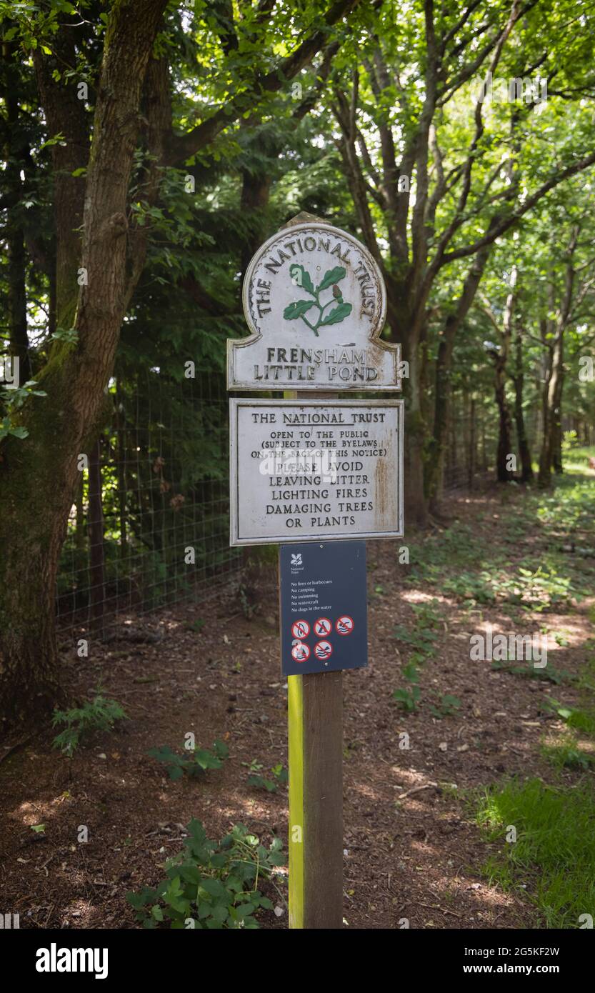 National Trust sign at Frensham Little Pond near Farnham, Surrey, south-east England, a popular outdoor beauty spot and recreational area Stock Photo