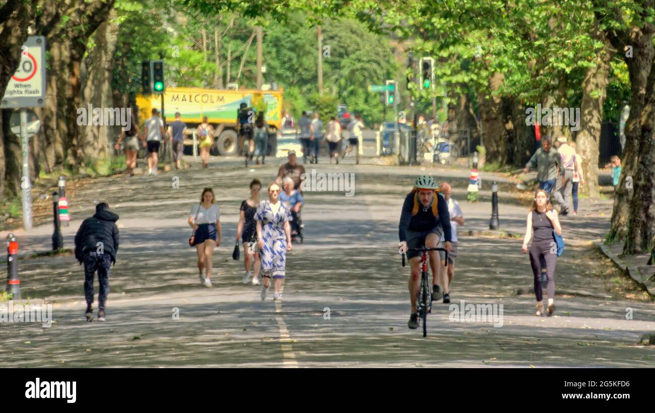 Glasgow, Scotland, UK, 28th  June, 2021. UK  Weather:  Summer scorcher in the city as locals make the most of the weather in kelvin way the pedestranised road near kelvingrove park. . Credit: Gerard Ferry/Alamy Live News Stock Photo